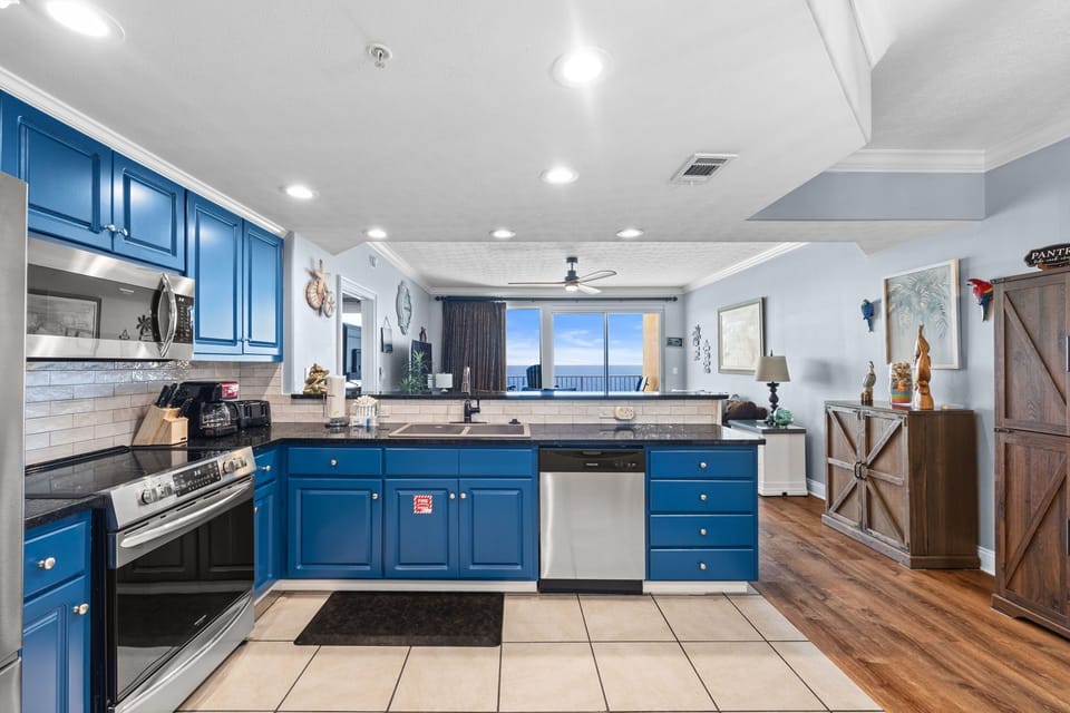 Cook your favorite meals in this bright, fully-equipped kitchen with stunning ocean views framing your culinary experience.