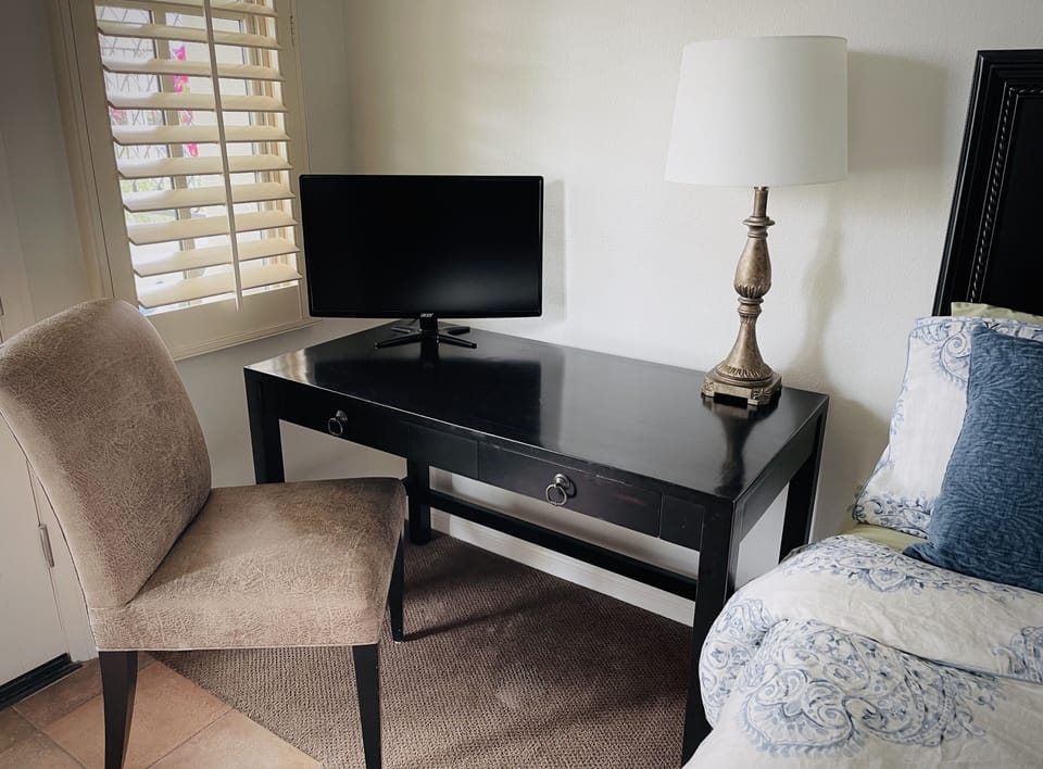 Poolside Suite desk and computer monitor. Perfect for workcations!