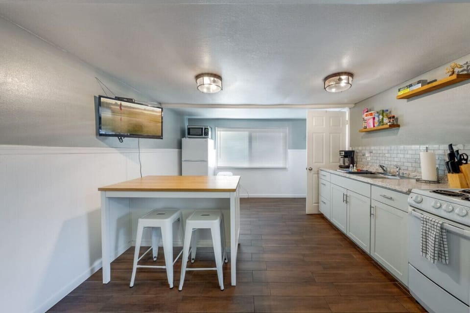 Kitchen area with island/dining space with seating for 4