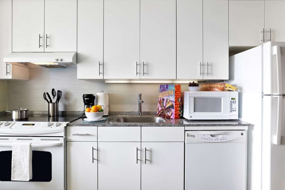 Cook comfortably with a full kitchenette and ample counter space.