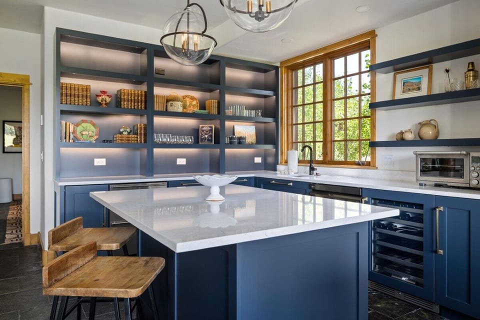 Sip and snack easily with a sleek built-in beverage fridge.