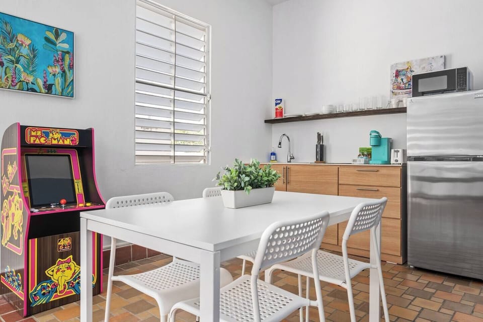 Get comfortable in our delightful kitchenette, where a timeless arcade game awaits endless enjoyment.