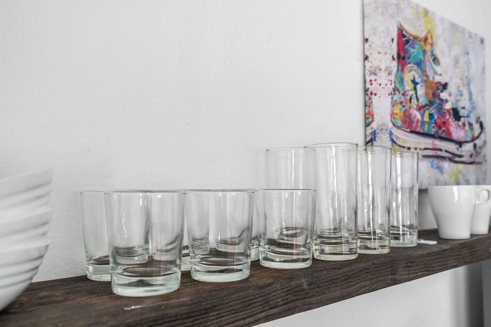 Our inviting kitchenette features with glasses