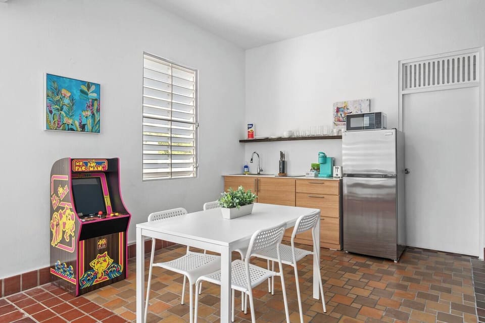 Experience coziness in our charming kitchenette, complete with a timeless arcade game for nonstop fun.