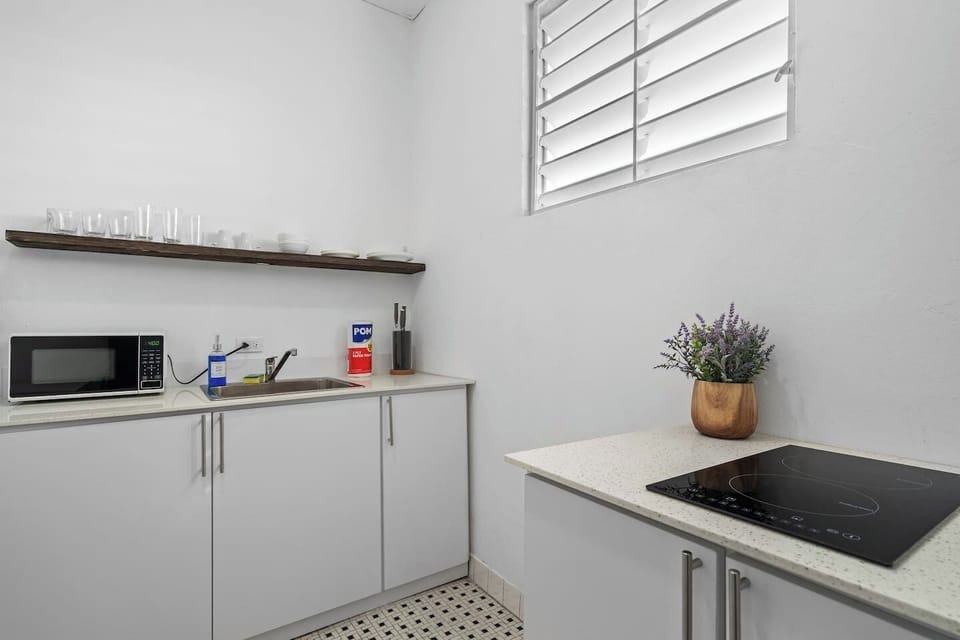 Warm wooden accents complement the modern appliances in this cozy preparation area.