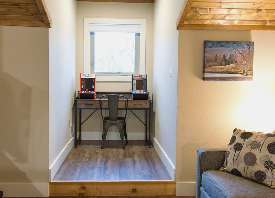 Upstairs desk with Kid Friendly arcade games. Who doesn't love PacMan & Frogger!