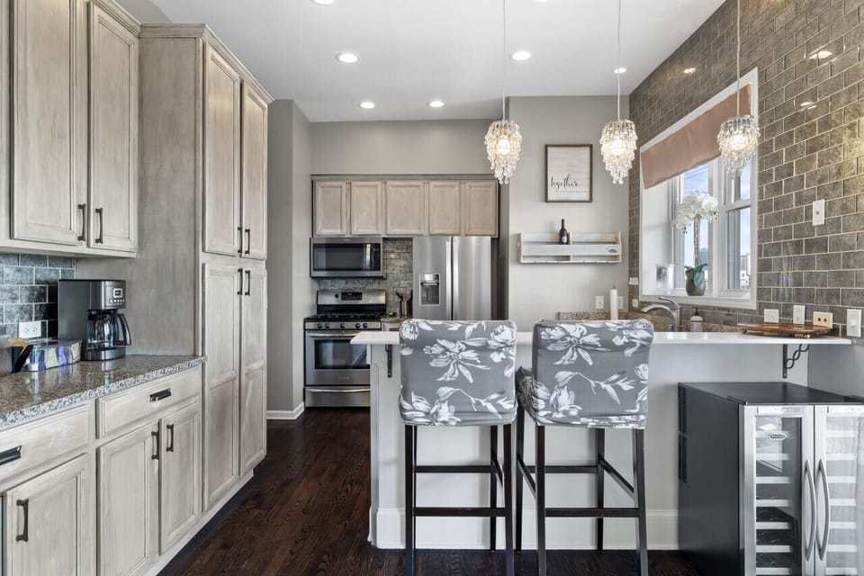 Stylish kitchen with convenient bar seating—perfect for morning coffee or casual bites!
