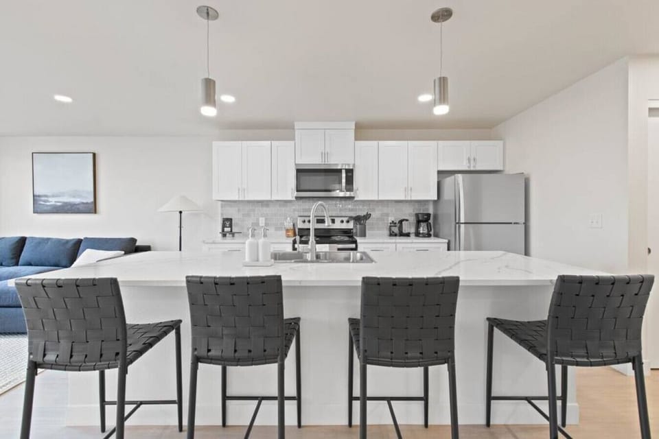 Open-concept design with quartz countertops and hand-picked finishes.