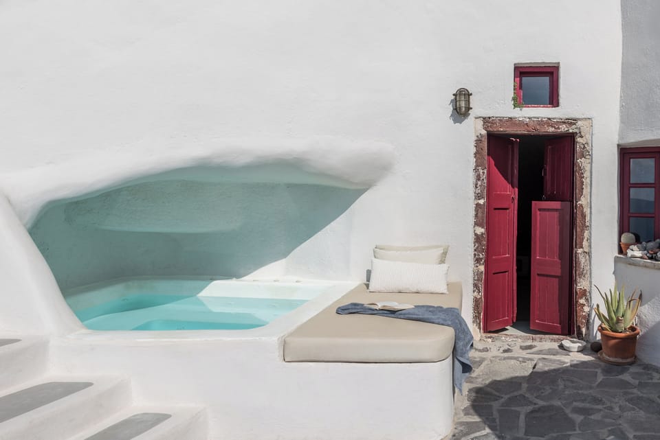 Soak up the sun on plush daybeds by the pool.