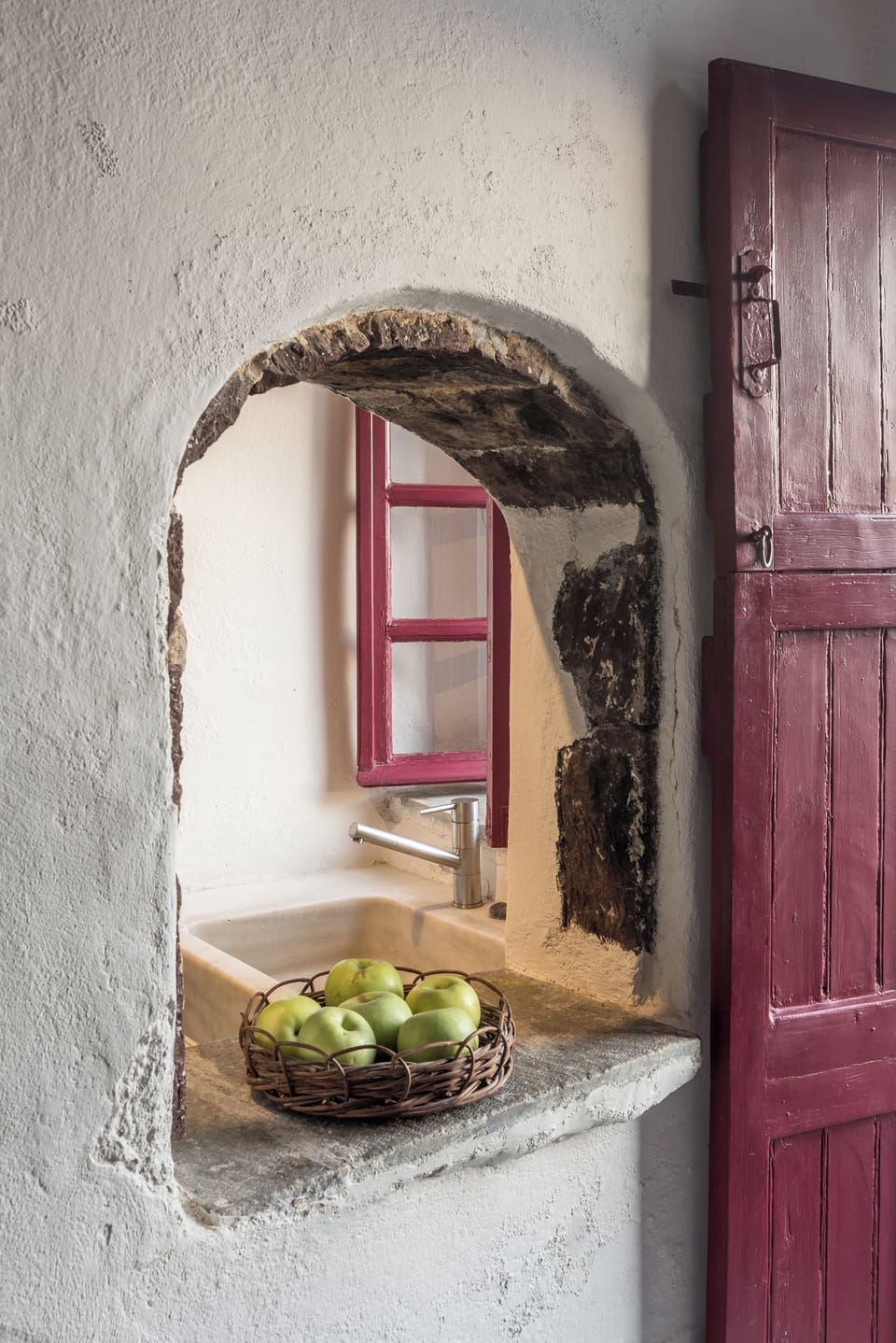 Savor morning snacks through this charming arched kitchenette window.