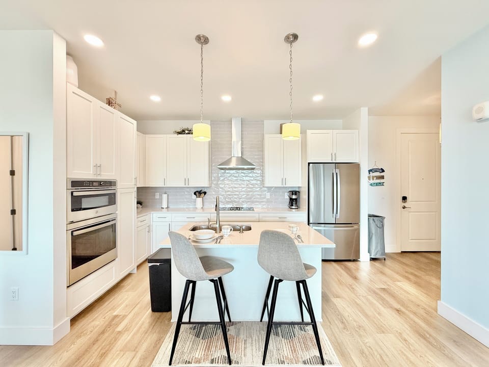 Stainless-steel appliances, 2 bar stools, new cookware, and more amenities