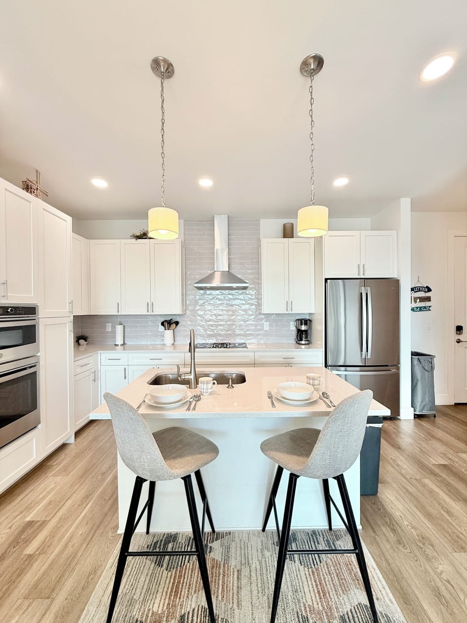 Stainless-steel appliances, 2 bar stools, new cookware, and more amenities, 