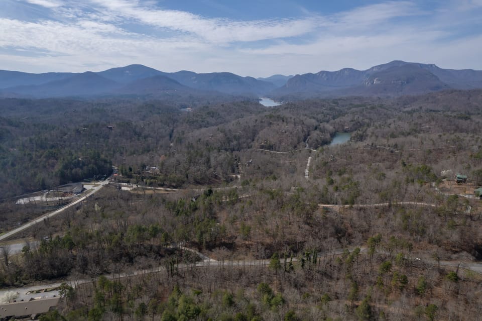 Upper drone up above the cabin: From the main level deck, you can see mtn views!