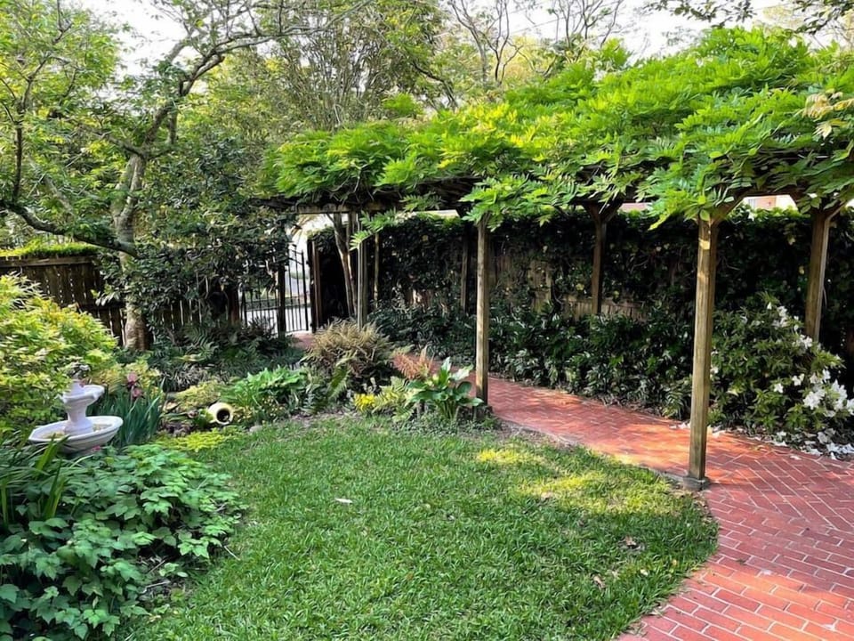 This is the front entry from the driveway. The trellis is covered with Wisteria 