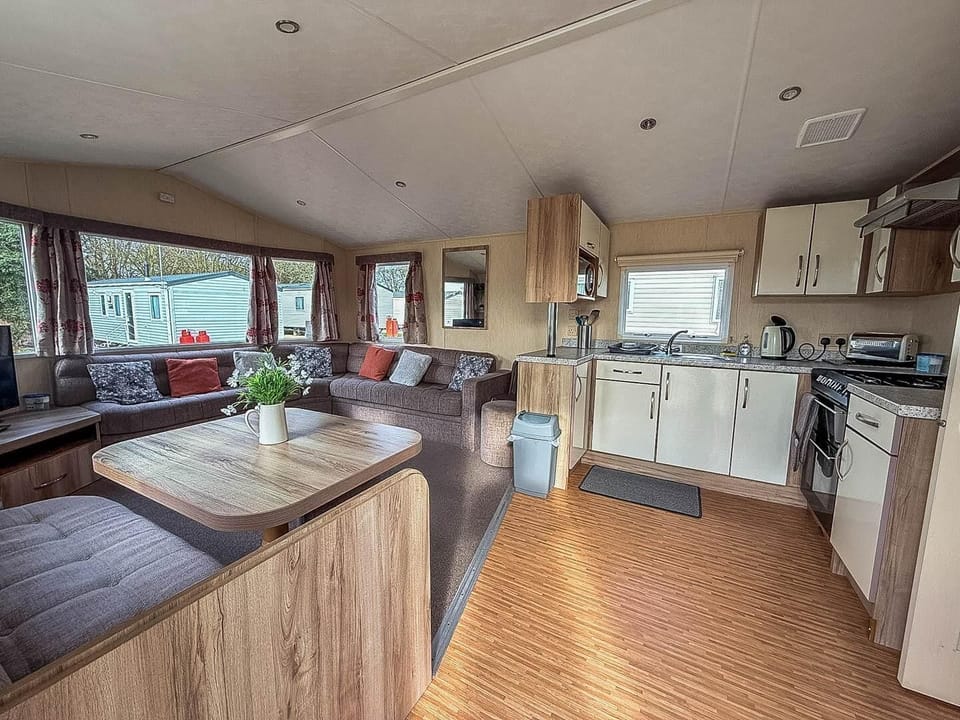 The kitchen area in a caravan at Broadlands Sands Holiday Park is perfect for preparing family meals after a day exploring Suffolk beaches and Lowestoft beach Suffolk.