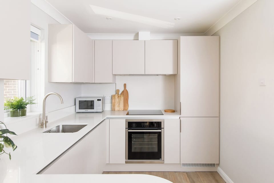 Fully equipped kitchen with storage and appliances 