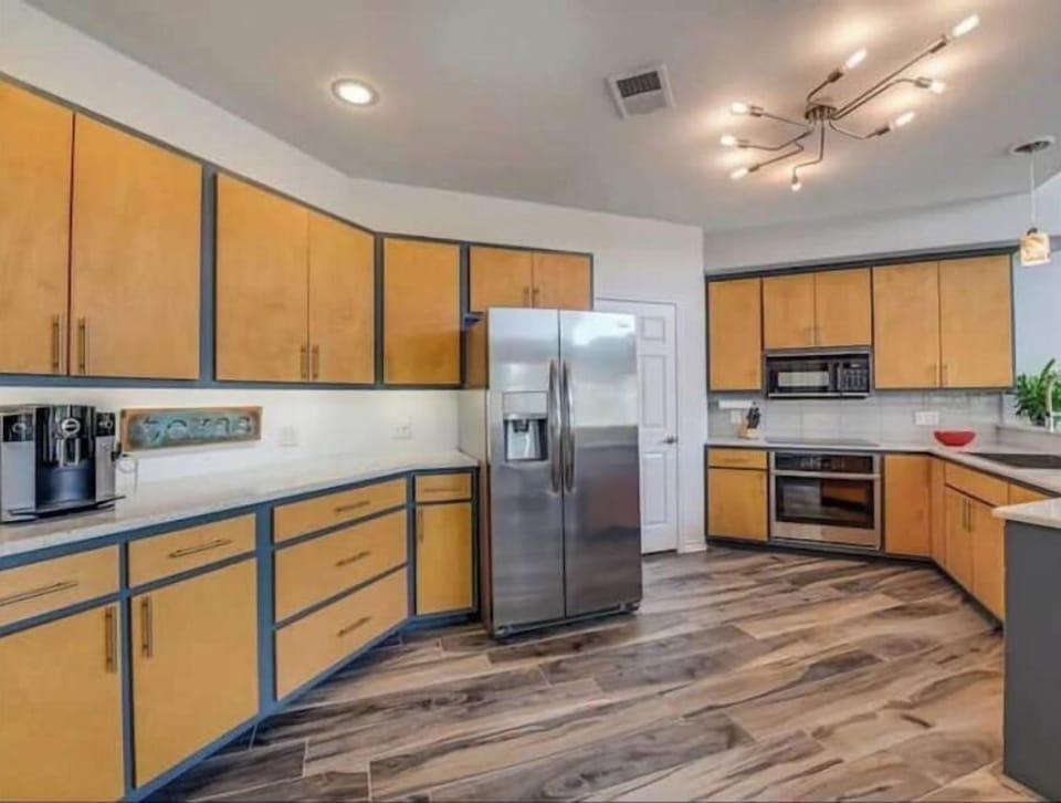 Full-size appliances and coffee & tea station. A washer and dryer is in pantry
