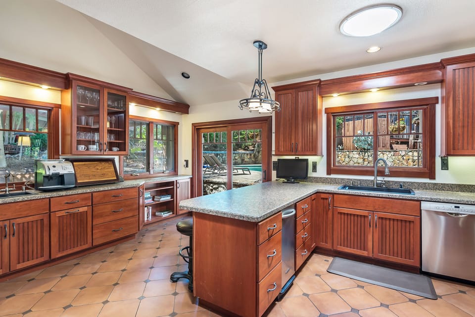 Ample counterspace, bar/counter seating, and tons of light means everyone can prep meals.