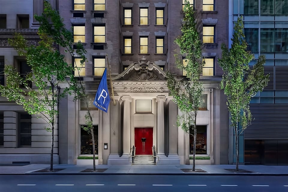 Feel the city buzz at a beautifully lit, iconic entrance.