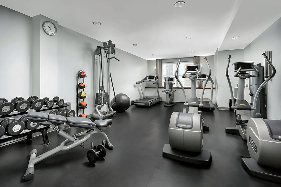 Recharge with a full workout in the bright, modern gym.