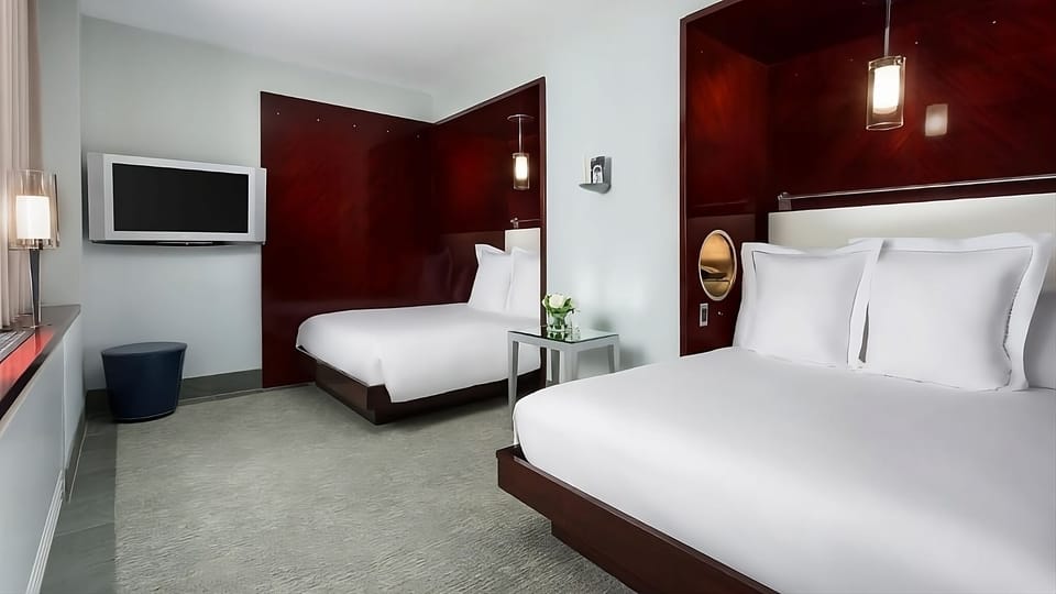 Stretch out in a bright double-queen room with large TV.