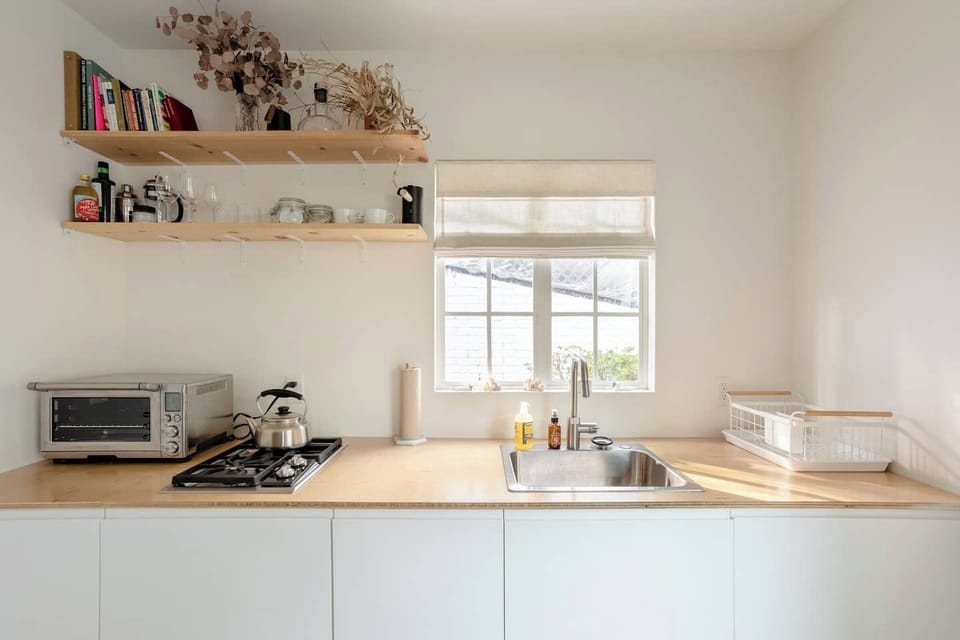 Kitchenette with integrated refrigerator.