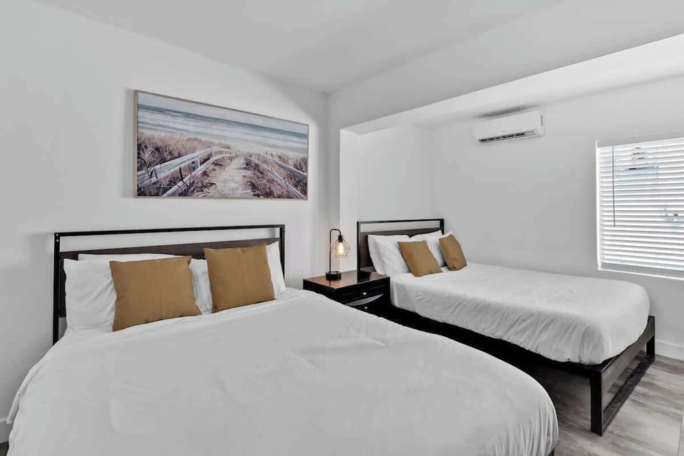 Unwind in this bright, modern bedroom with two cozy double beds—perfect for families or friends traveling together. Enjoy plush pillows, clean linens, and a peaceful night’s sleep in your vacation home away from home.


