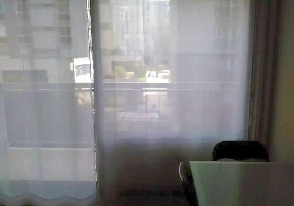 Main Room (view on the balcony, street and vis-a-vis buildings)