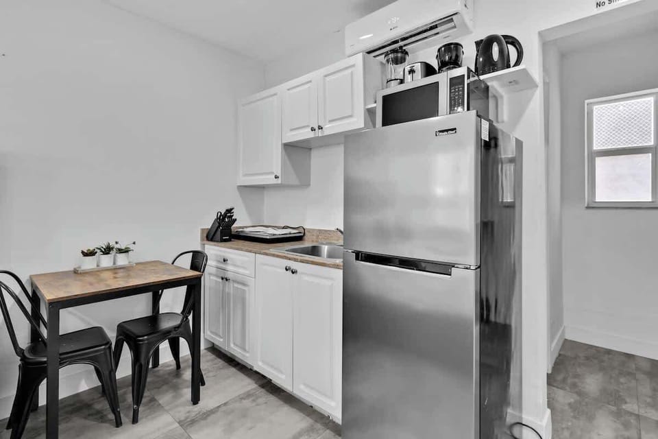 Enjoy your morning coffee or a quick meal in this fully equipped kitchenette with modern appliances. Great for extended stays or travelers who love cooking in their vacation rental.

