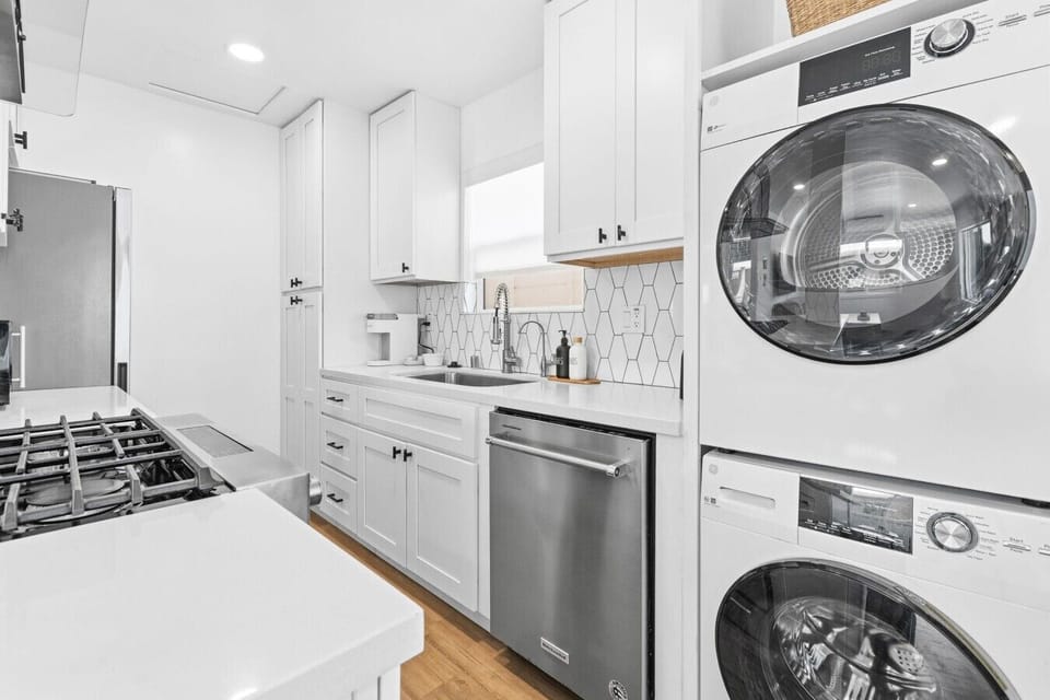 Bright, modern kitchen with all the essentials and in-unit laundry for a hassle-free stay.