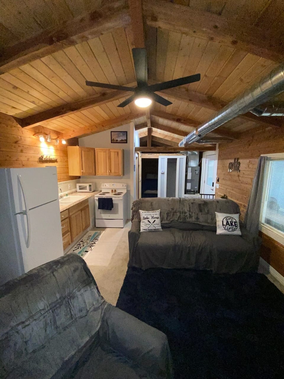 Full access kitchen and living room area with beautiful lake decor!