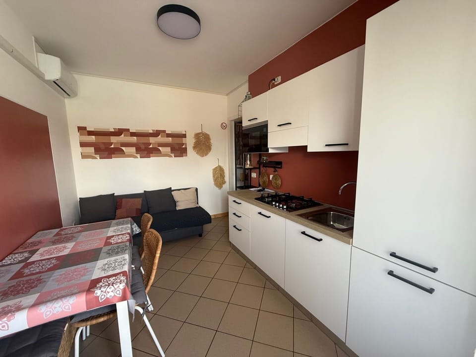 Flooring, Interior Design, Floor, Furniture, Room, Apartment, Cabinetry, Cupboard, Major Appliance, Kitchen