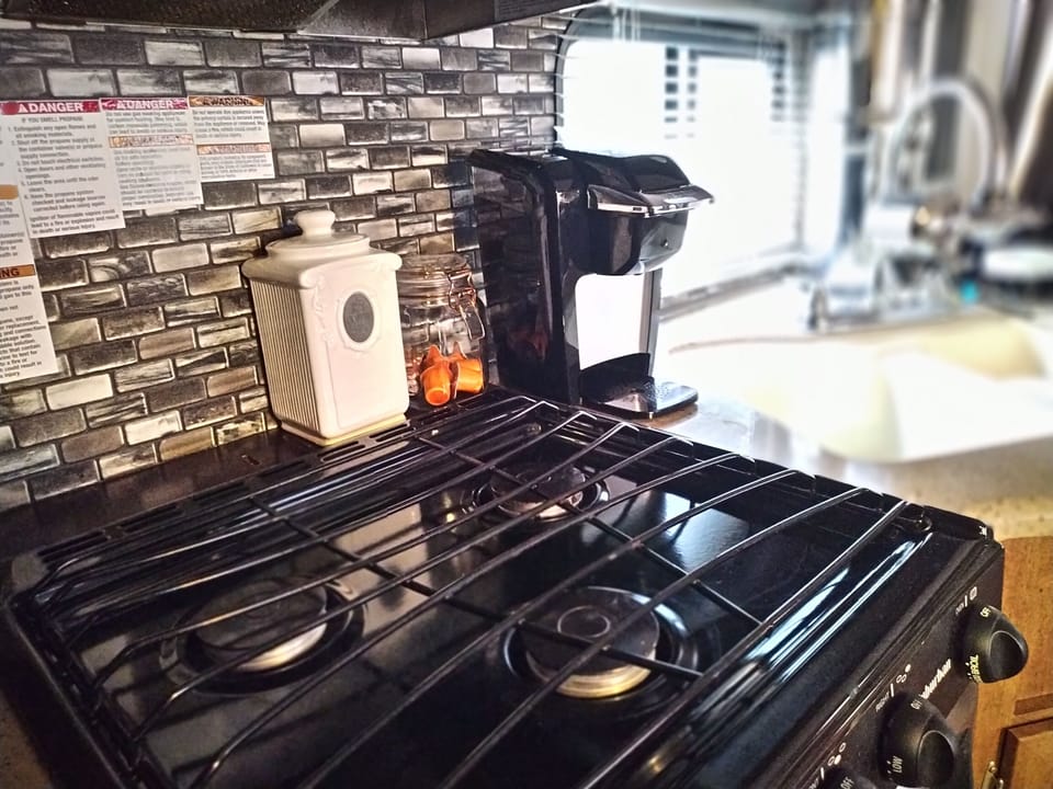 Keurig coffee maker with complimentary coffee pods creamer and sugar