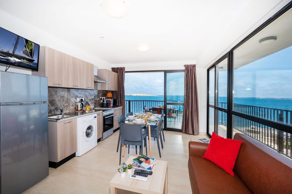 Kitchen, dining area and sofa bed