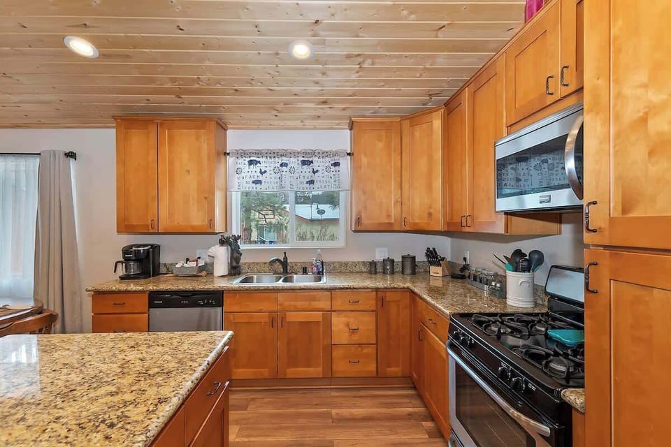 Spacious kitchen includes coffee pot and cooking utensils and essentials 