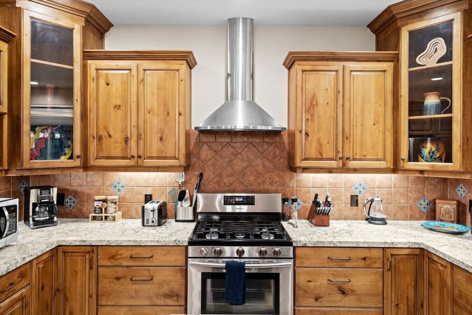 The kitchen has a gas stove and full suite of counter appliances for the discerning chef.