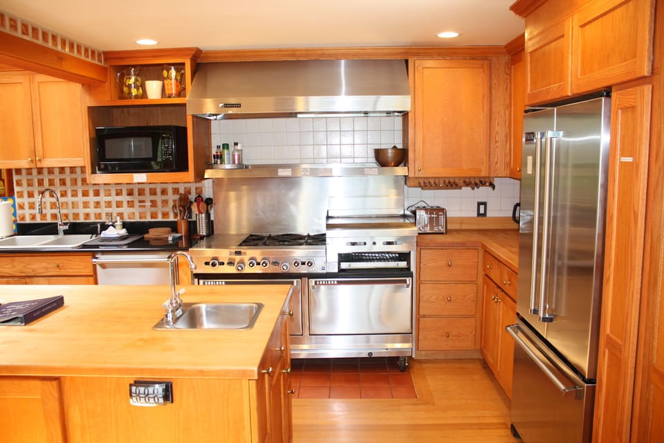 Kitchen with commercial range. 