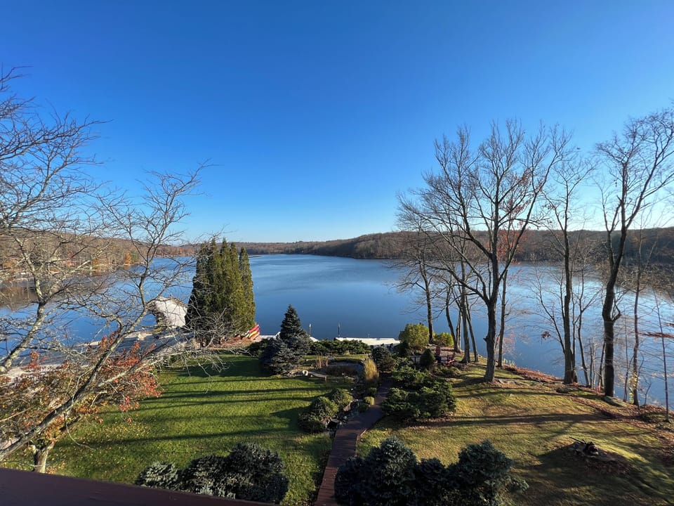 View of lake from deck off main level living/dining rooms.