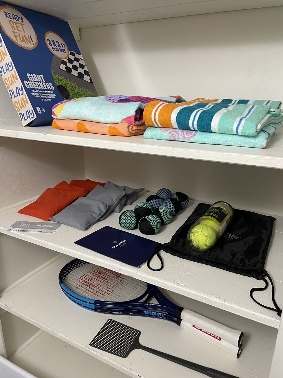 Towels for the public pool, balls for the outside games and tennis racquets