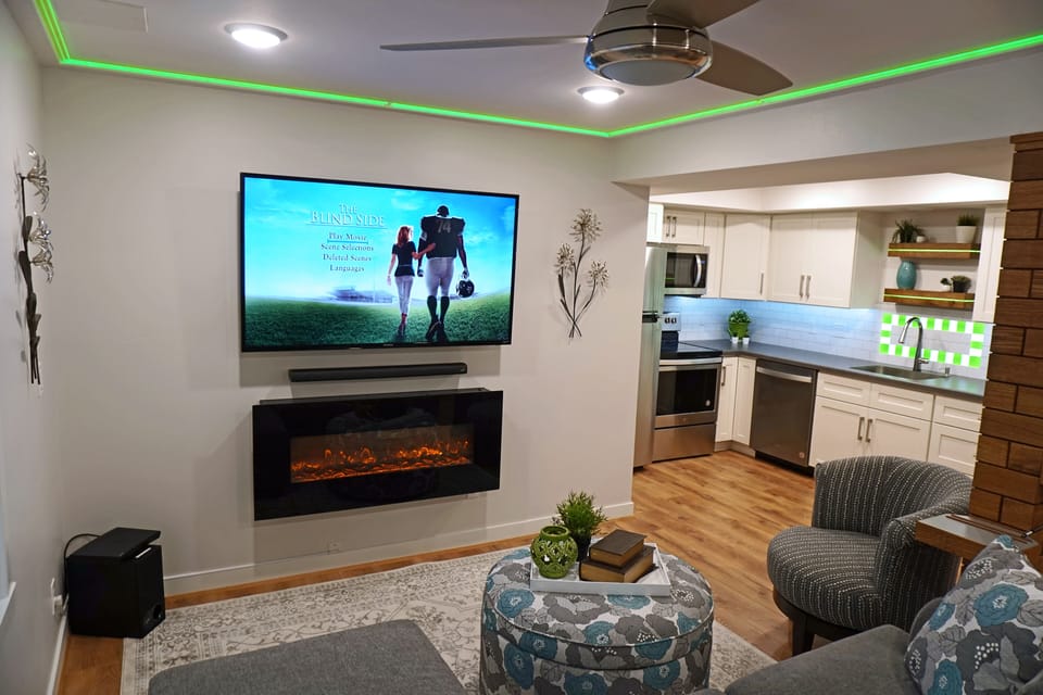 60" Smart TV with Soundbar, Subwoofer and Fireplace, LED designer lighting