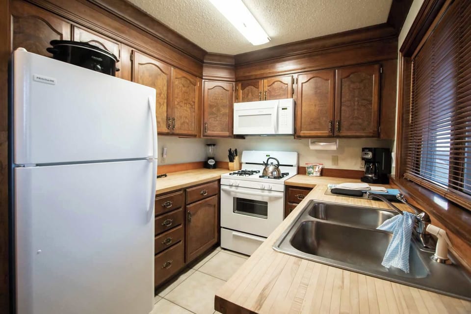Kitchen equipped with full size Appliances.