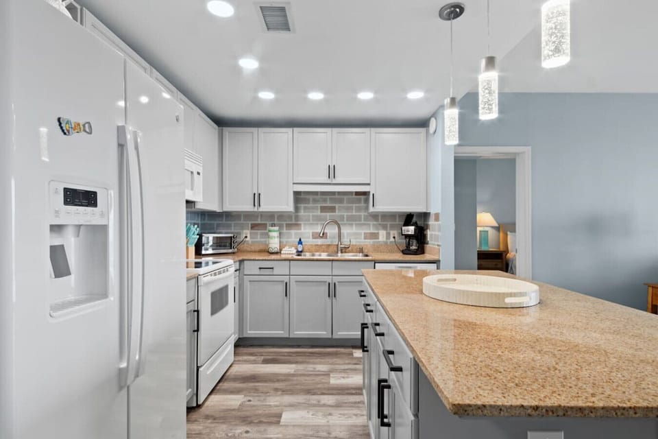 Fully Stocked Kitchen with Ocean Views and Island Bar Seating