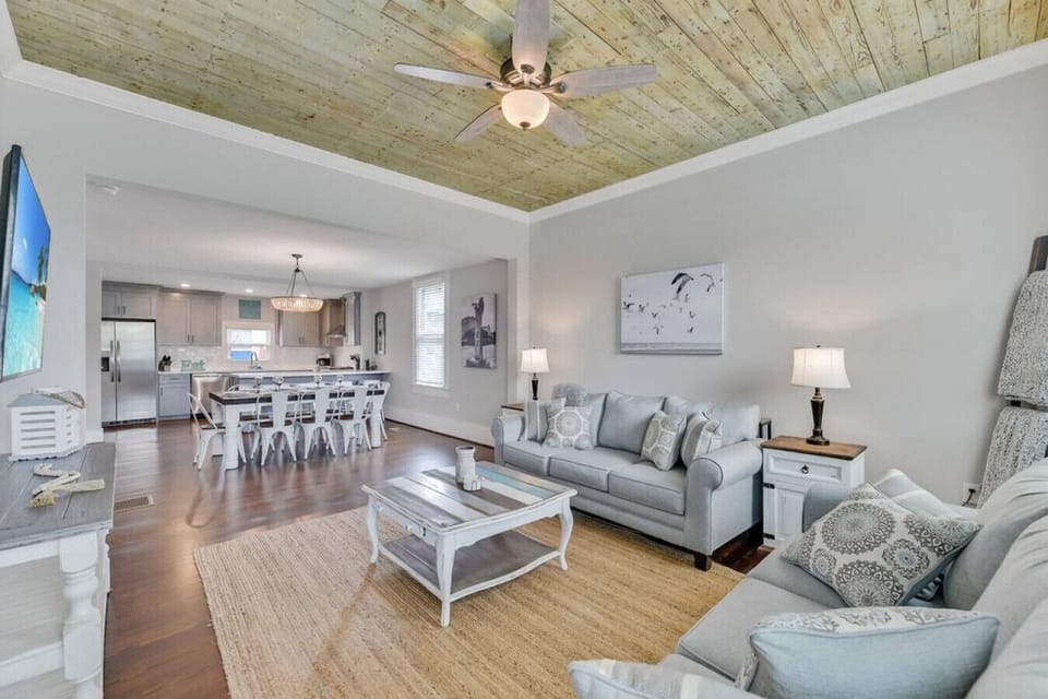 Beautiful beach decor living room | Stained shiplap accent ceiling