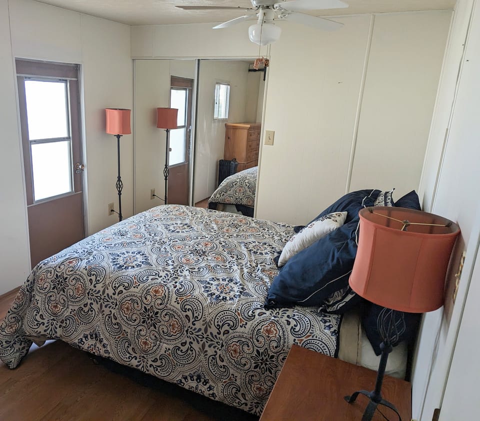 master suite includes with queen sized bed, closet and bath with shower