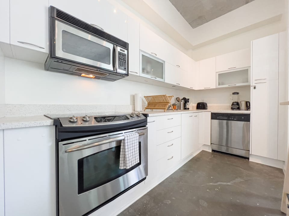 Immerse Yourself in the Art of Cooking with Our Full Kitchen, Complete with All the Essential Appliances for a Seamless Culinary Experience.