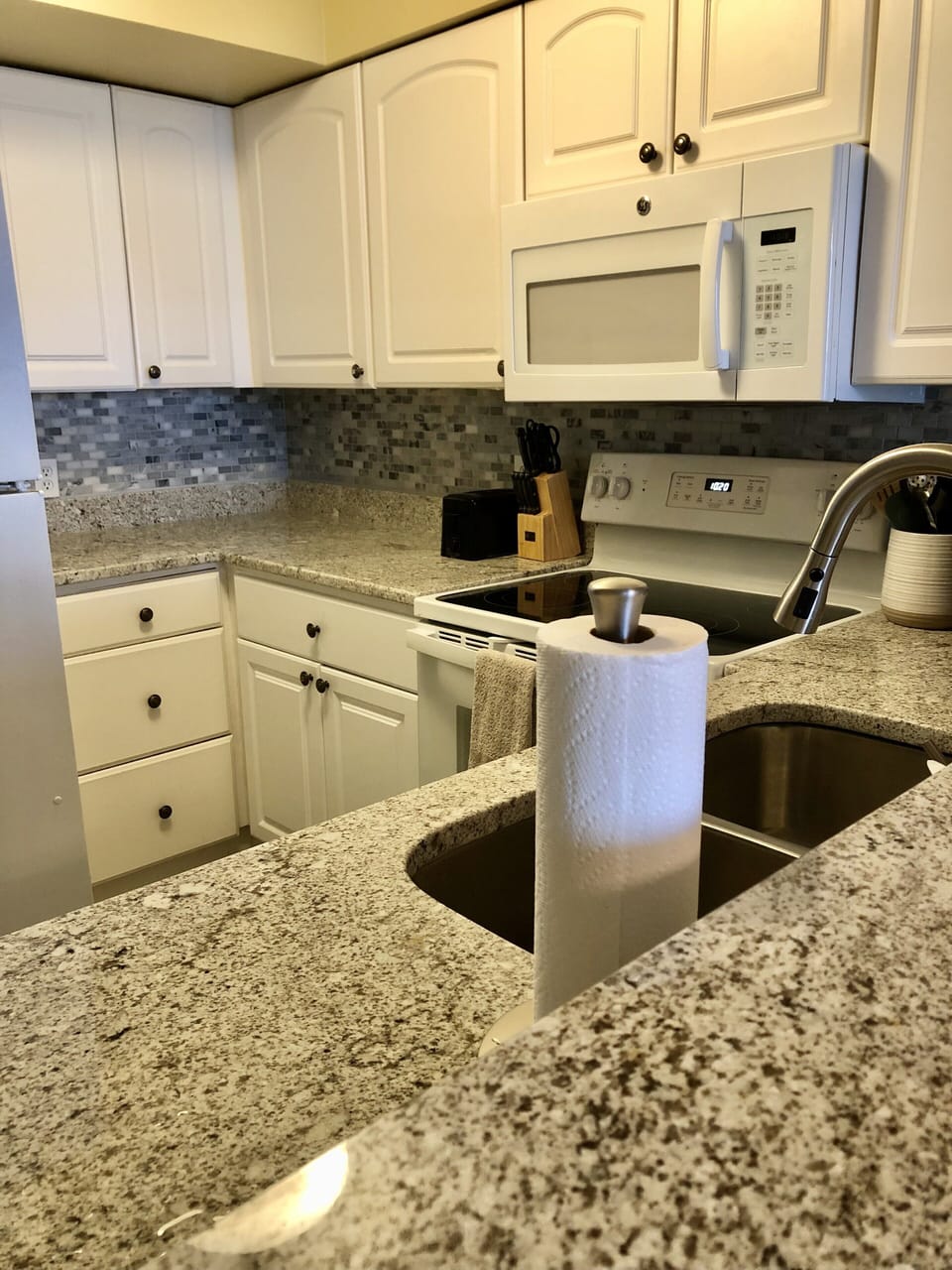 Updated Kitchen with new stove and dishwasher, and granite counters