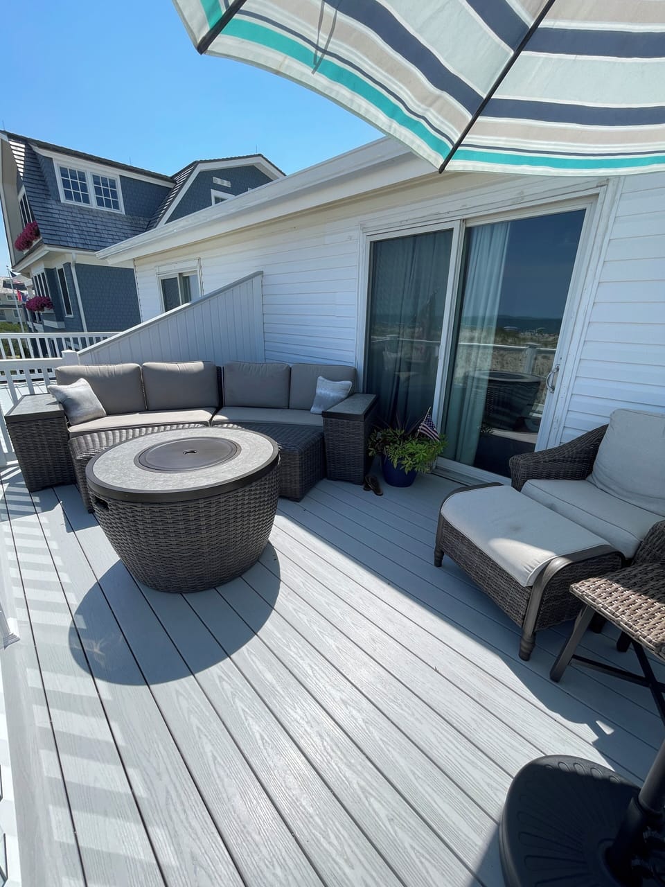 2nd story deck with comfortable seating, a fire table, and a SPECTACULAR VIEW!!!