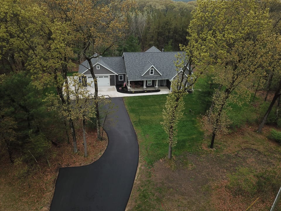 Aerial view of home on 5 acres