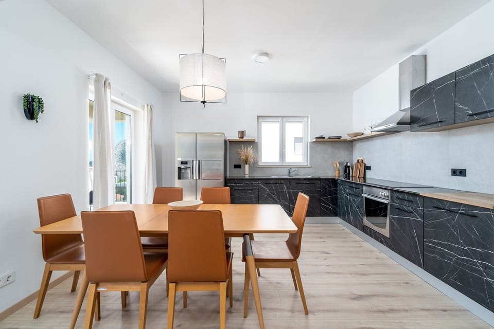 The 2nd floor ( with separate entrance) offers a spacious living area (40sqm) with comfortable sofa, TV, A/C, a panoramic window...