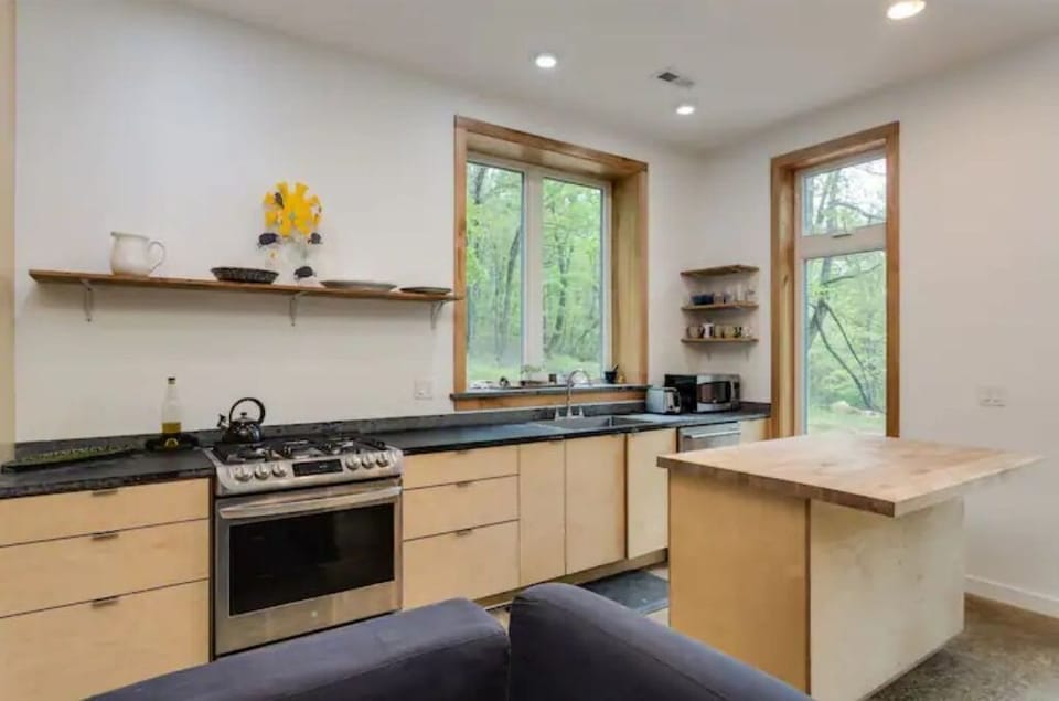 Ample, well-equipped kitchen with local soapstone countertops & 6 burner range